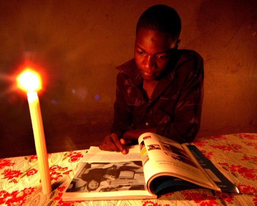 Zimbabwean student Tawanda Moyo 15 years of Seke 2 Secondary School, in Harare doing his home work  at home using  candle light due to shortage of electricity which the country is facing.Zimbabwe now has the highest inflation rate in the world of 4000%