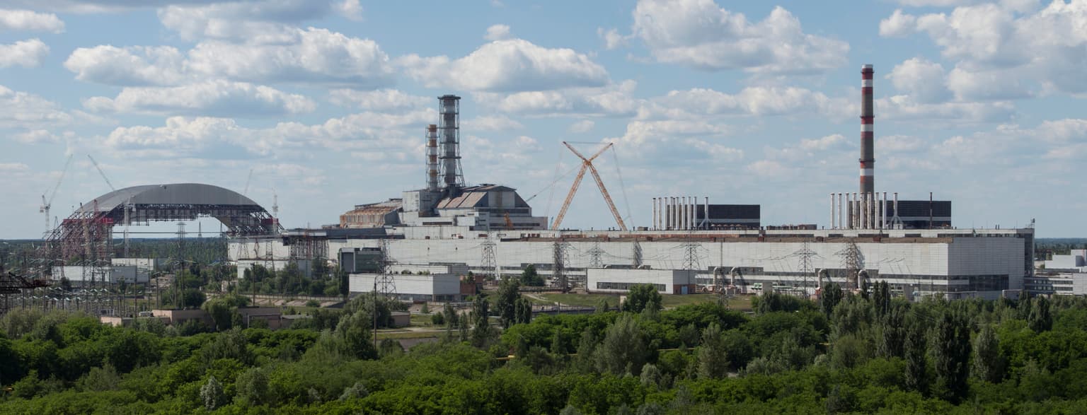 Chernobyl_NPP_Site_Panorama_with_NSC_Construction_-_June_2013