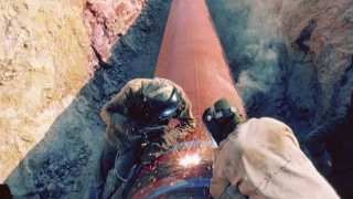 Laying large pipes in Jordan