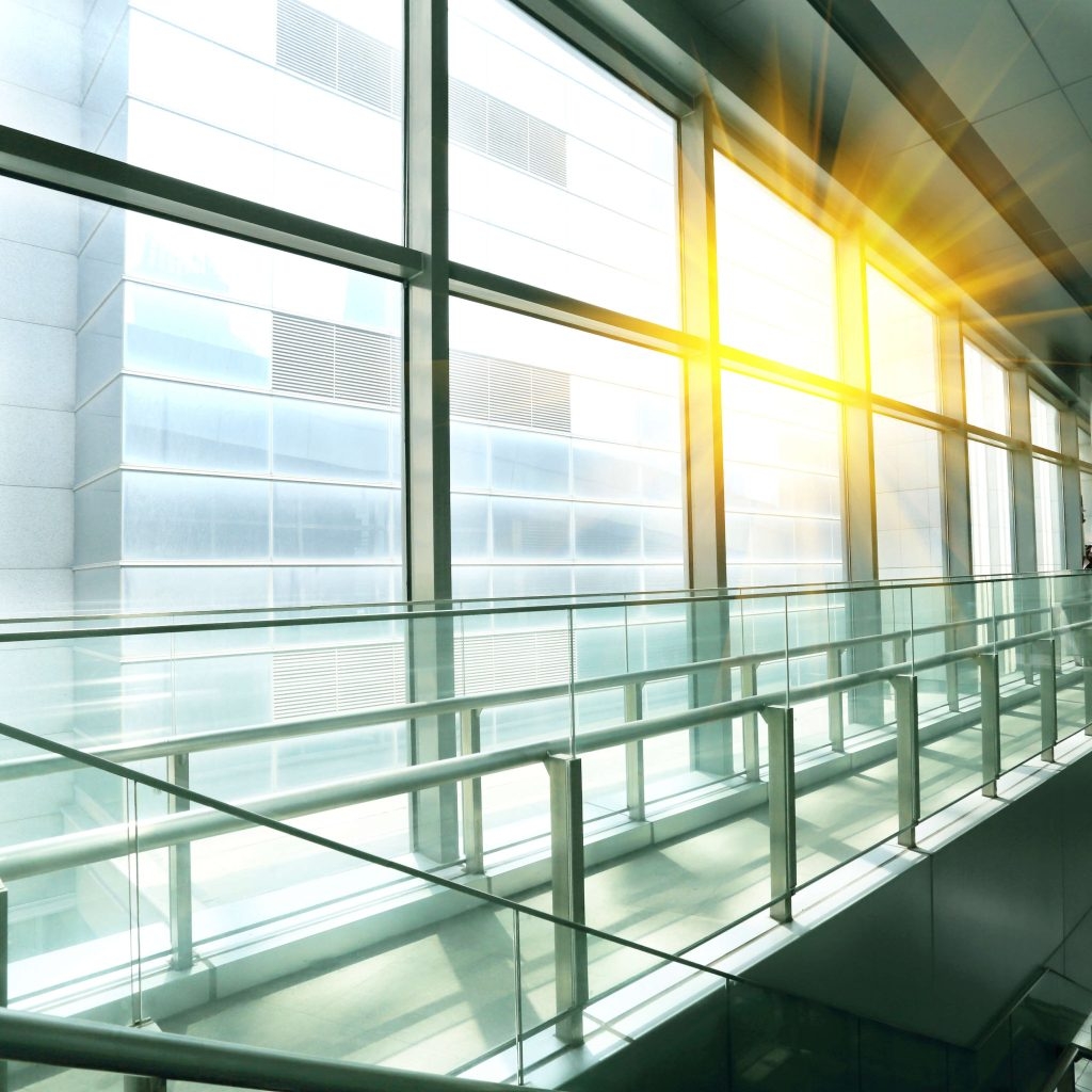 Sun shining modern office building stairway glass