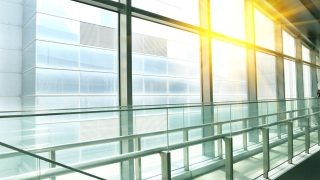 Sun shining modern office building stairway glass