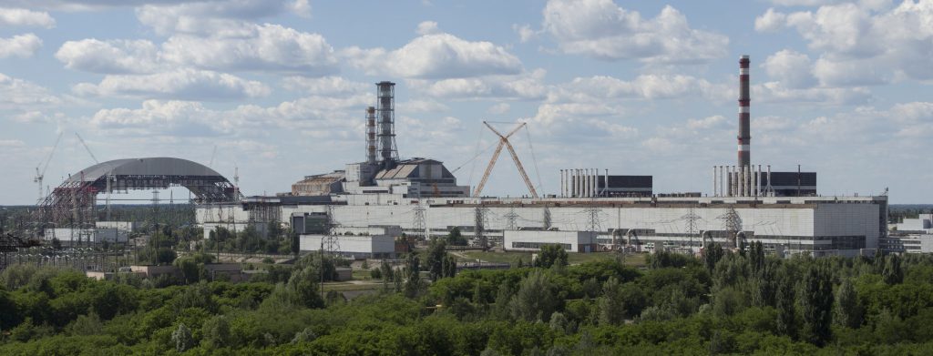 Chernobyl_NPP_Site_Panorama_with_NSC_Construction_-_June_2013